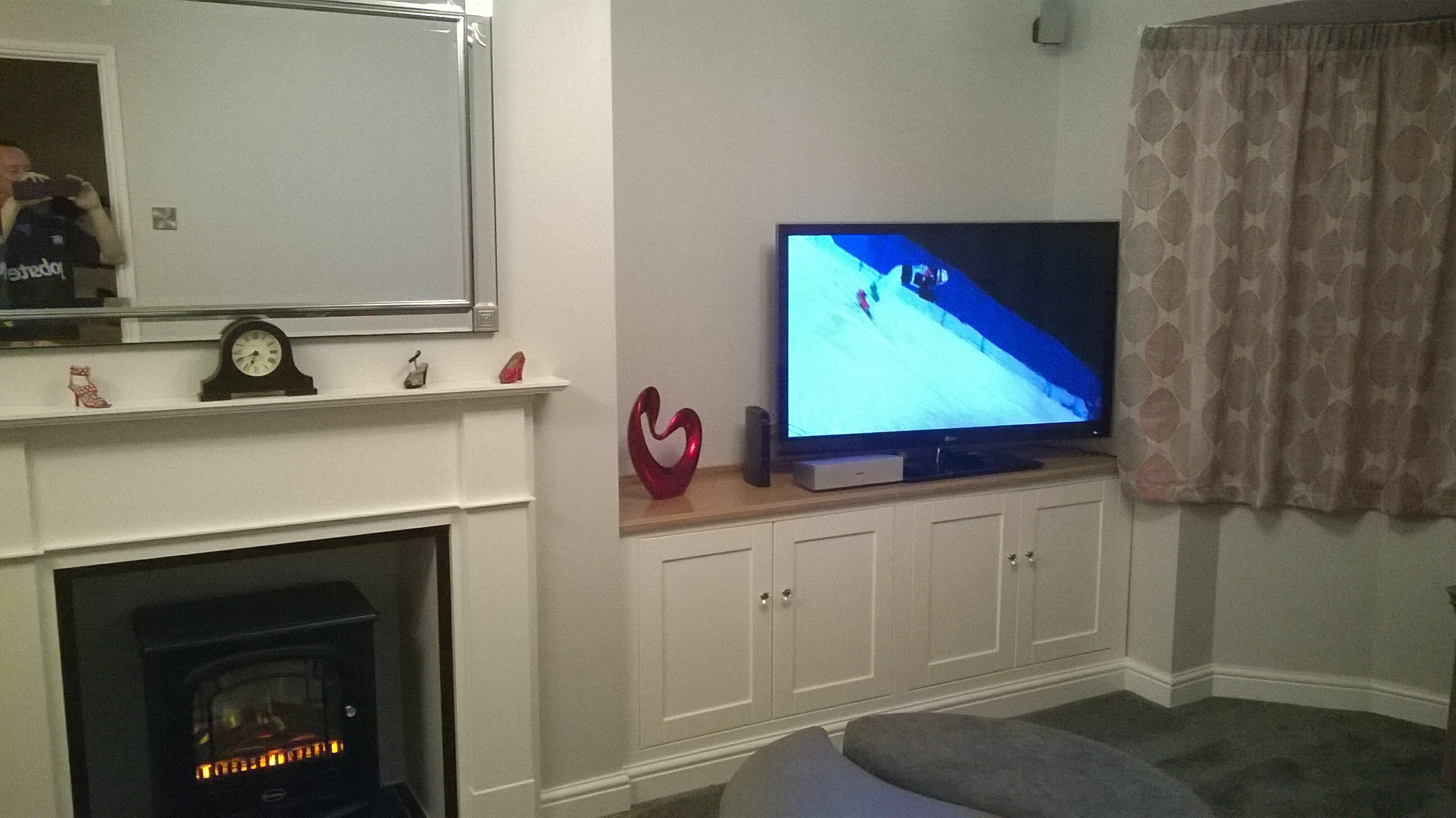 bespoke fireplace and cupboards built and fitted